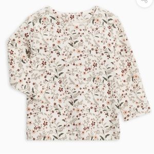 Long sleeve floral colored organics tee with snap shoulder. 12-18 months